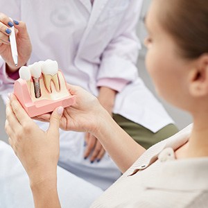 Dentist and patient discussing dental implant treatment plan