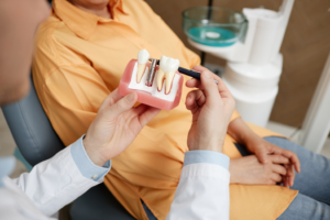 a patient during a dental implant consultation